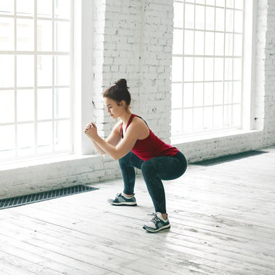 A woman doing a squat