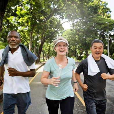 A group of seniors running in a park