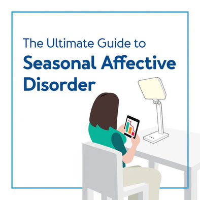 A woman sitting in front of a therapy lamp. Text, "The Ultimate Guide to Seasonal Affective Disorder"