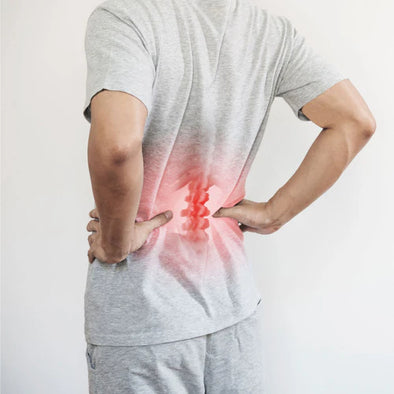 A man holding his back in pain