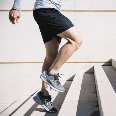 Man running up concrete steps