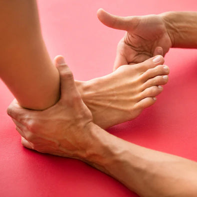 A person checking another person's foot
