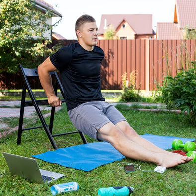 A man doing seated cardio outside