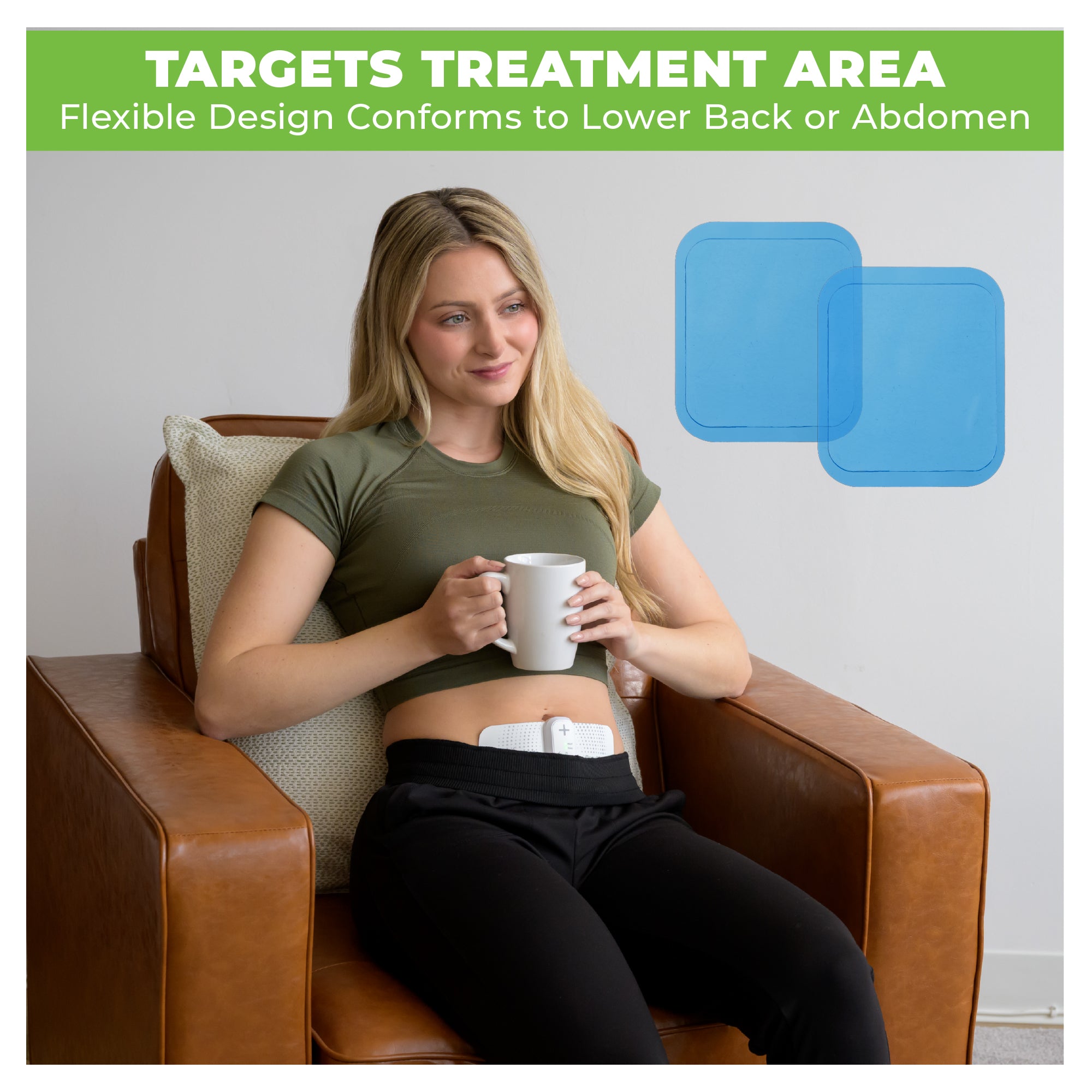 Woman sitting on a brown armchair holding a white mug, wearing a medical device on her abdomen.