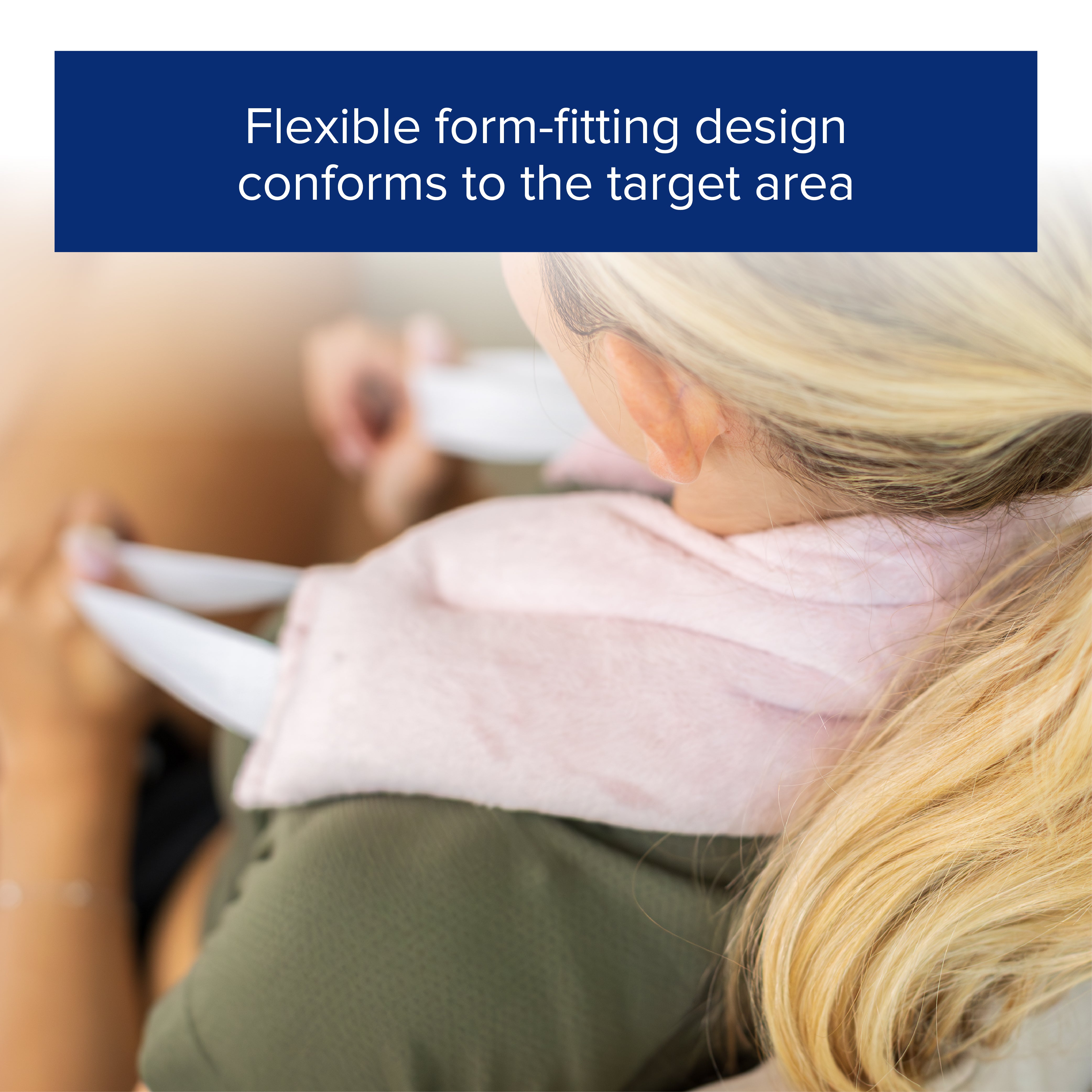 Close up of a woman with a pink hot and cold neck wrap on her neck and shoulders.