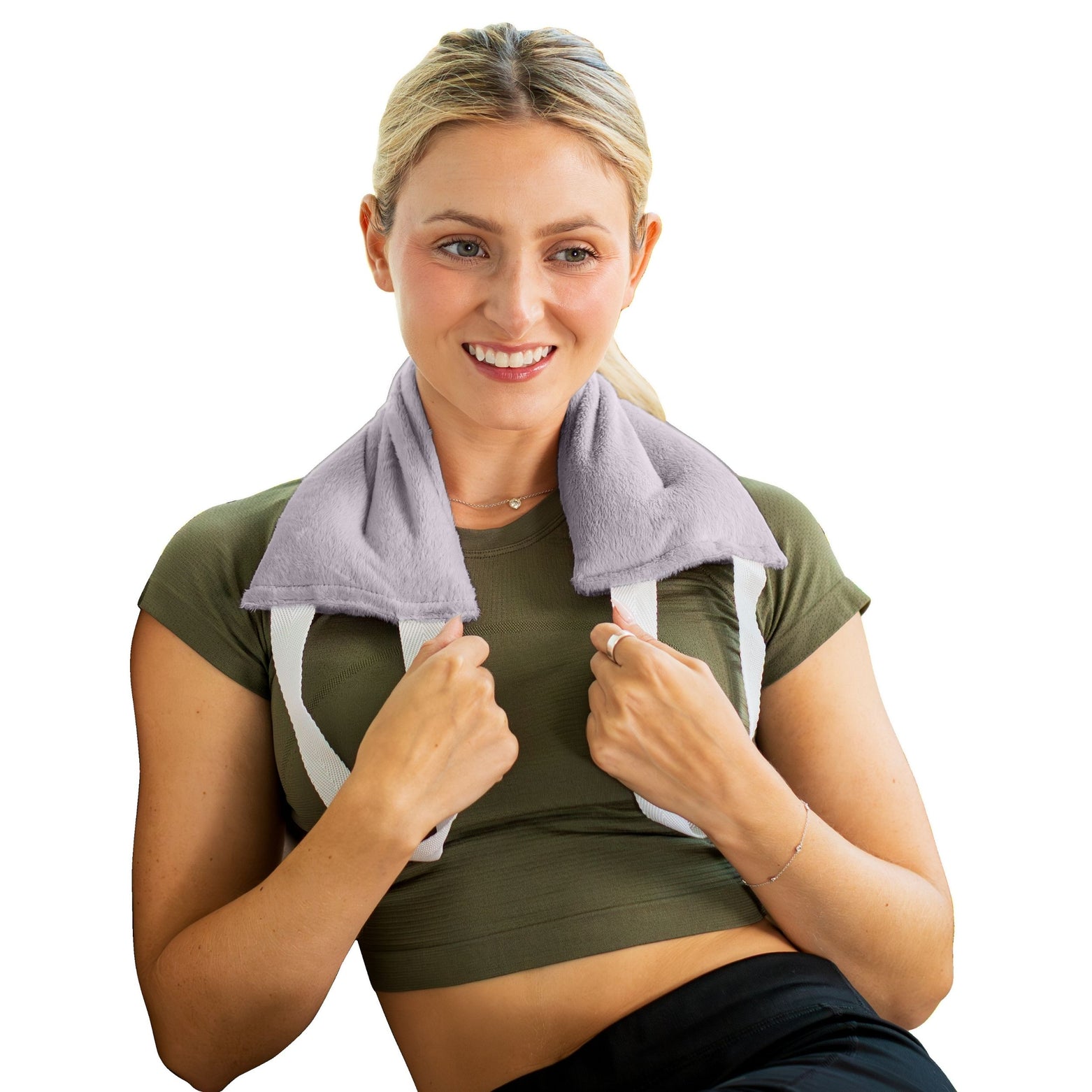 Woman with gray hot and cold therapy wrap on neck and shoulders, wearing green athletic outfit, on white background