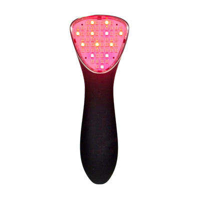 A black red light therapy device for pain with its lights on