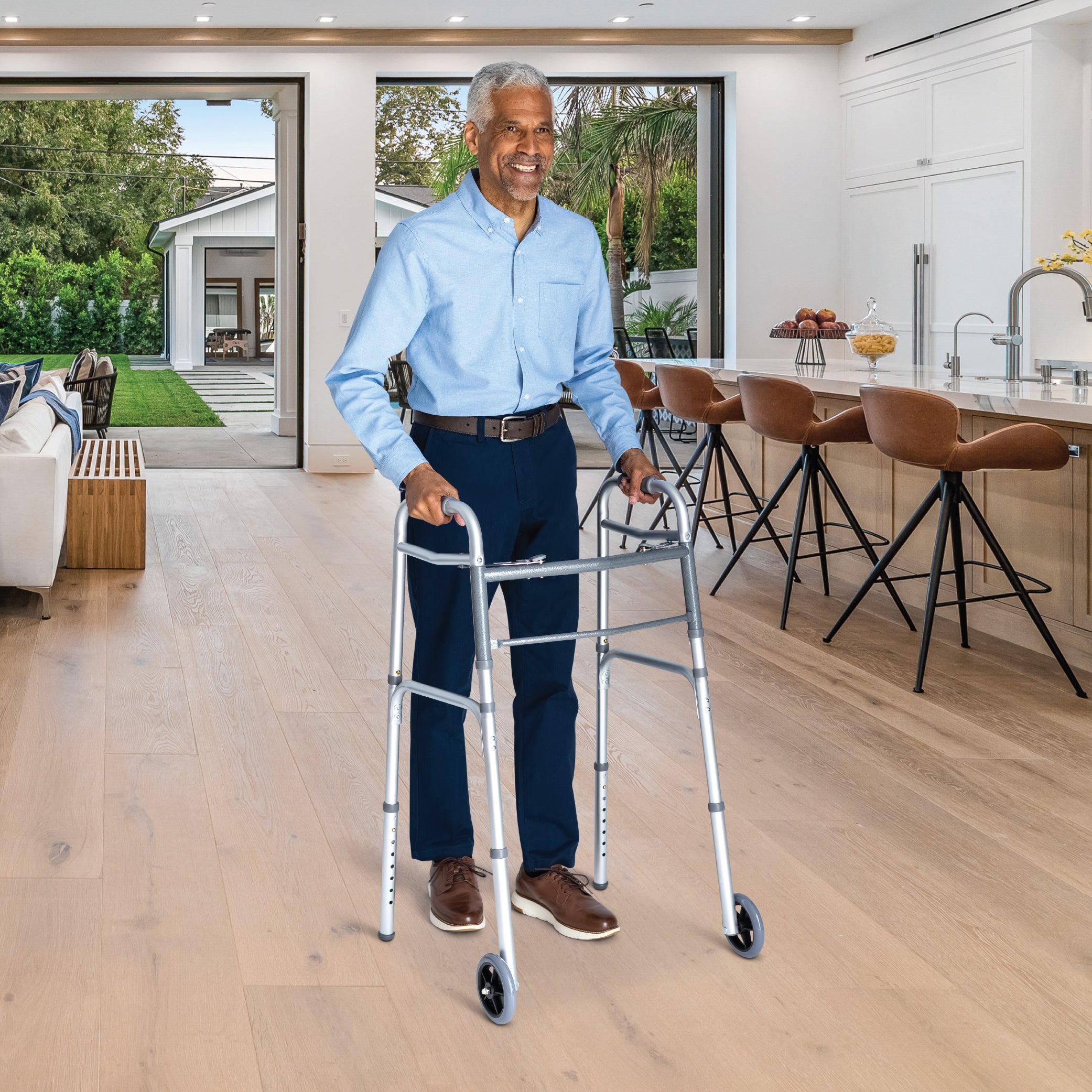 Man using a walker in a modern kitchen