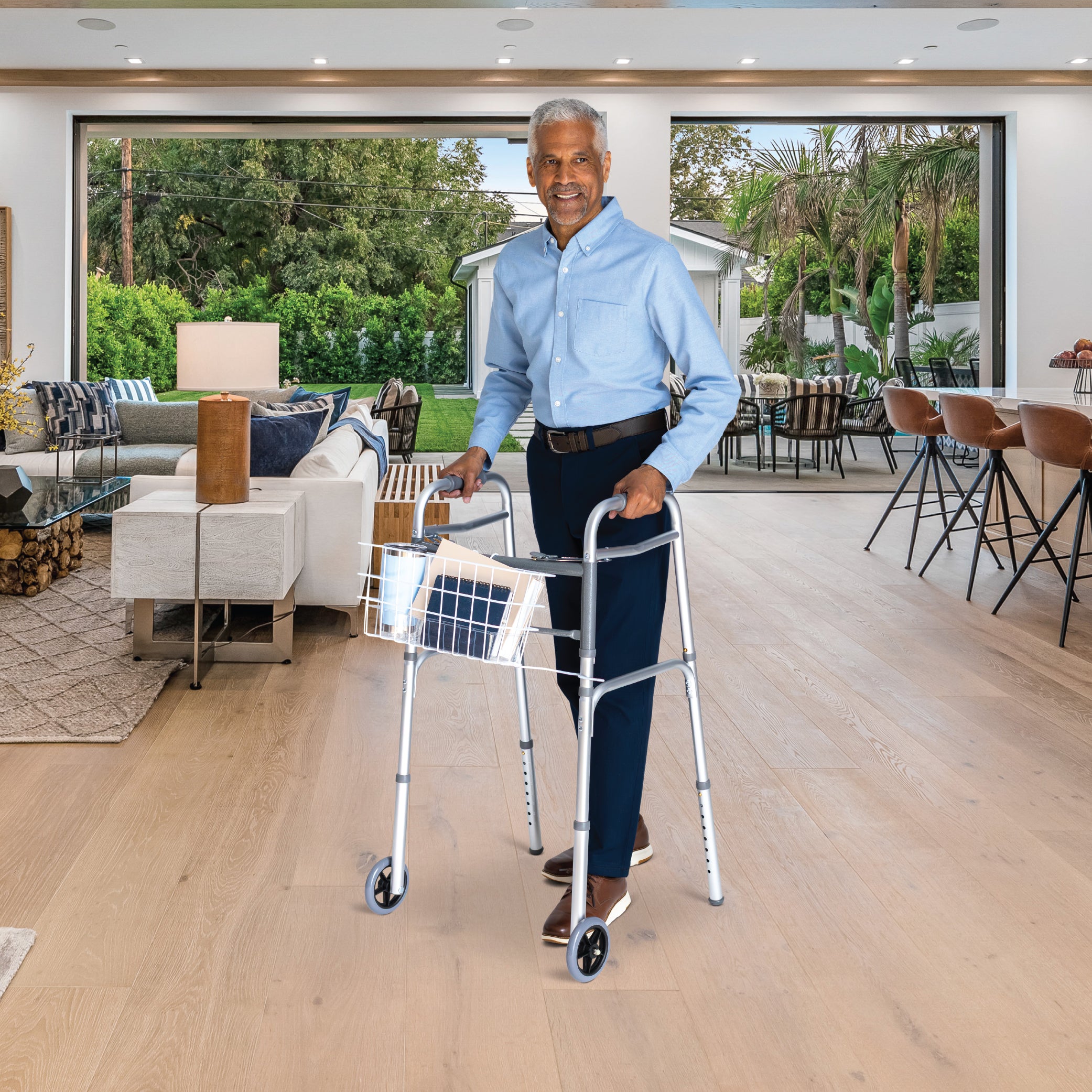 Man using a walker with a solar panel in a modern living room.
